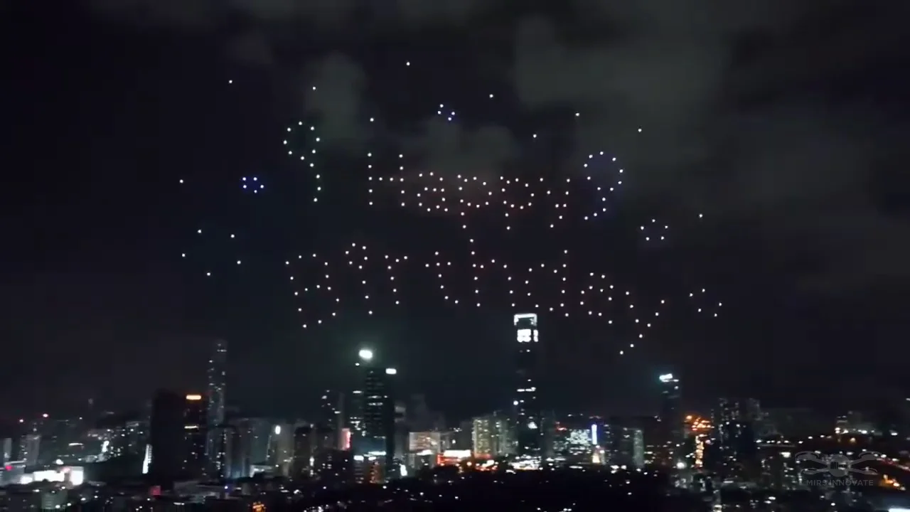 Happy Wedding text formation created by 200 drones above an overseas cityscape