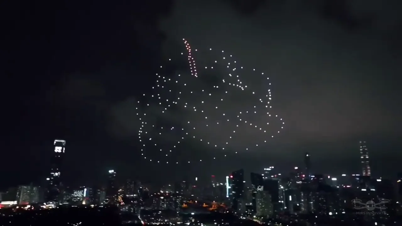 Birthday cake formation created by 200 drones above an overseas cityscape