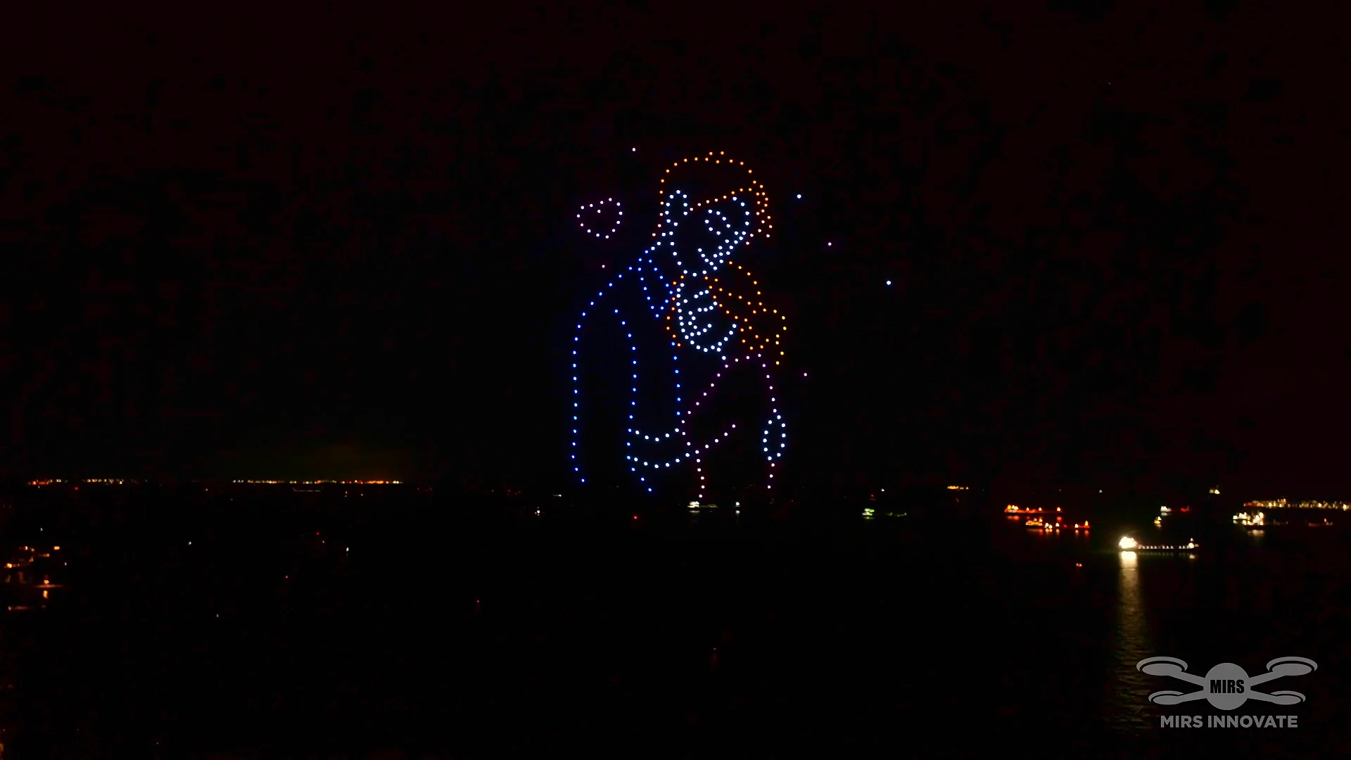 Where Our Story Began embracing couple formation in a private family drone light show in Singapore