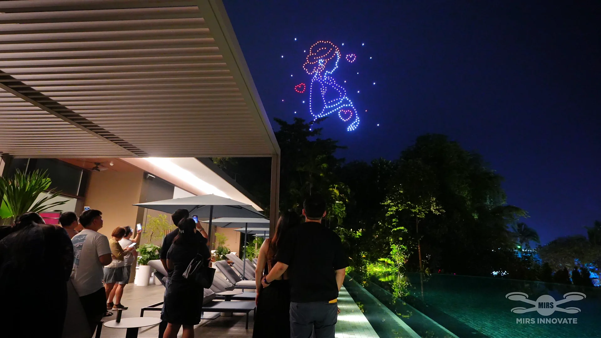 Guests watching Love Grows Within during a private Sentosa family celebration