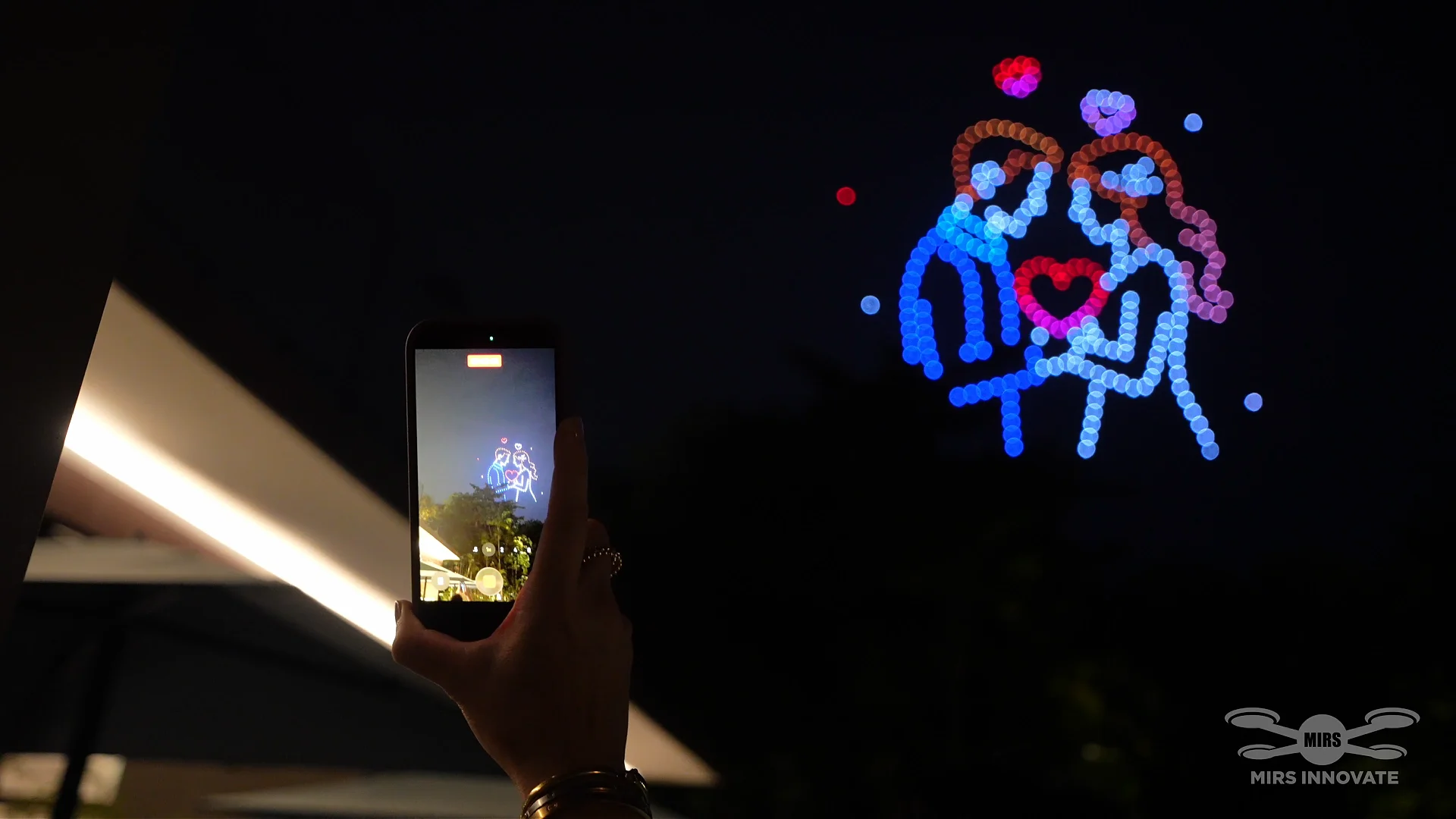 Phone recording A Promise for Forever during a Sentosa family celebration drone show