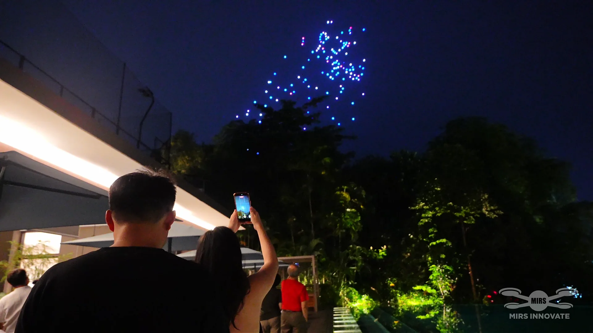 Guest recording the opening sequence of a 300-drone family celebration at Sentosa Singapore