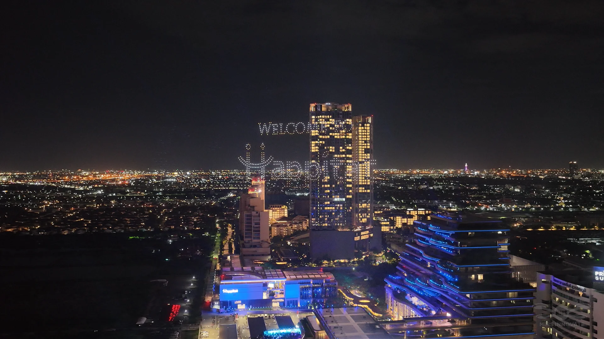 Welcome to Happitat text formation created with drones above Bangkok