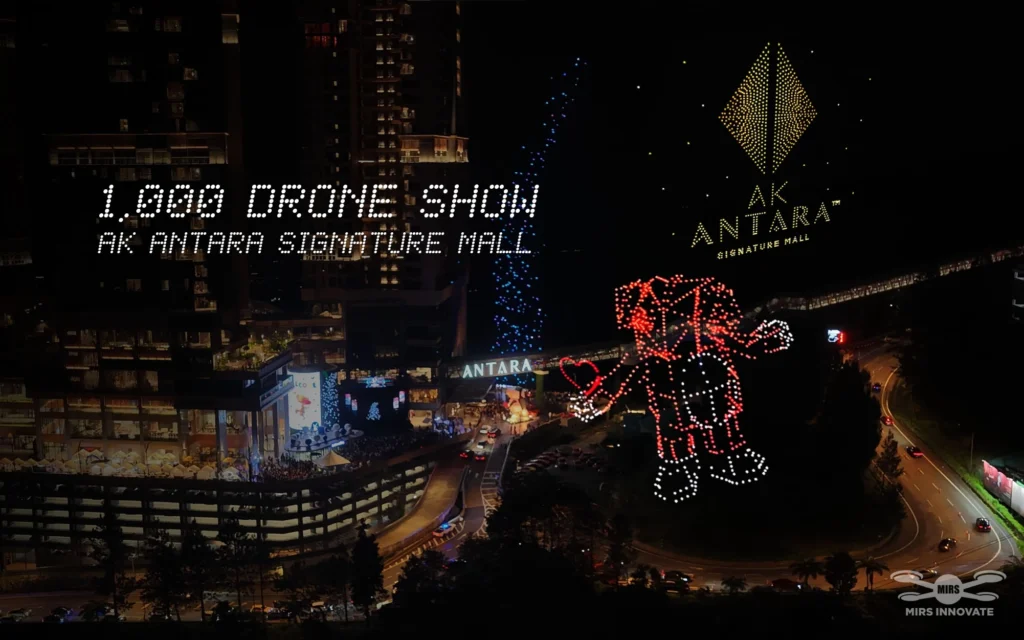 Antara Signature Mall wording, diamond emblem and character drone formation above Genting at night