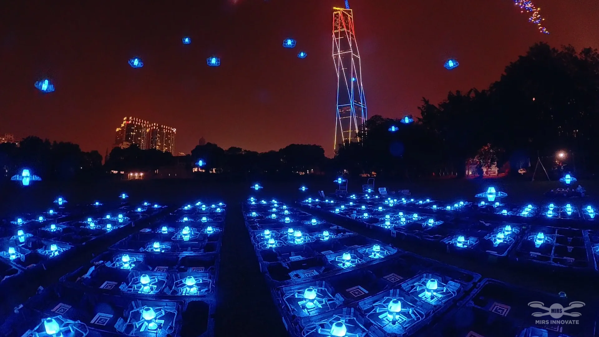 Illuminated drone fleet ground setup near Merdeka 118 before the JPJ NPI launch